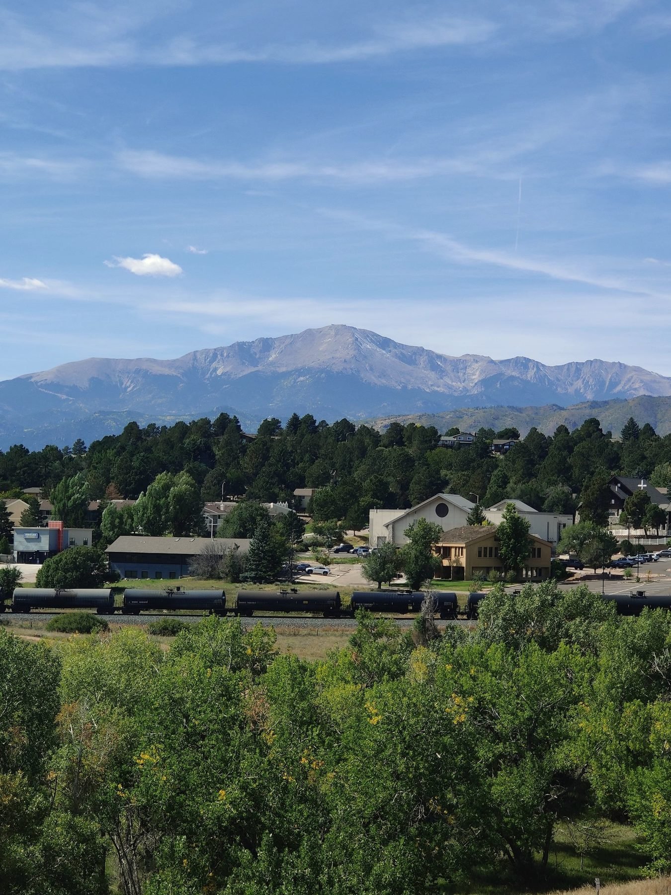 Pikes Peak rising behind the town of Colorado Springs, Colorado