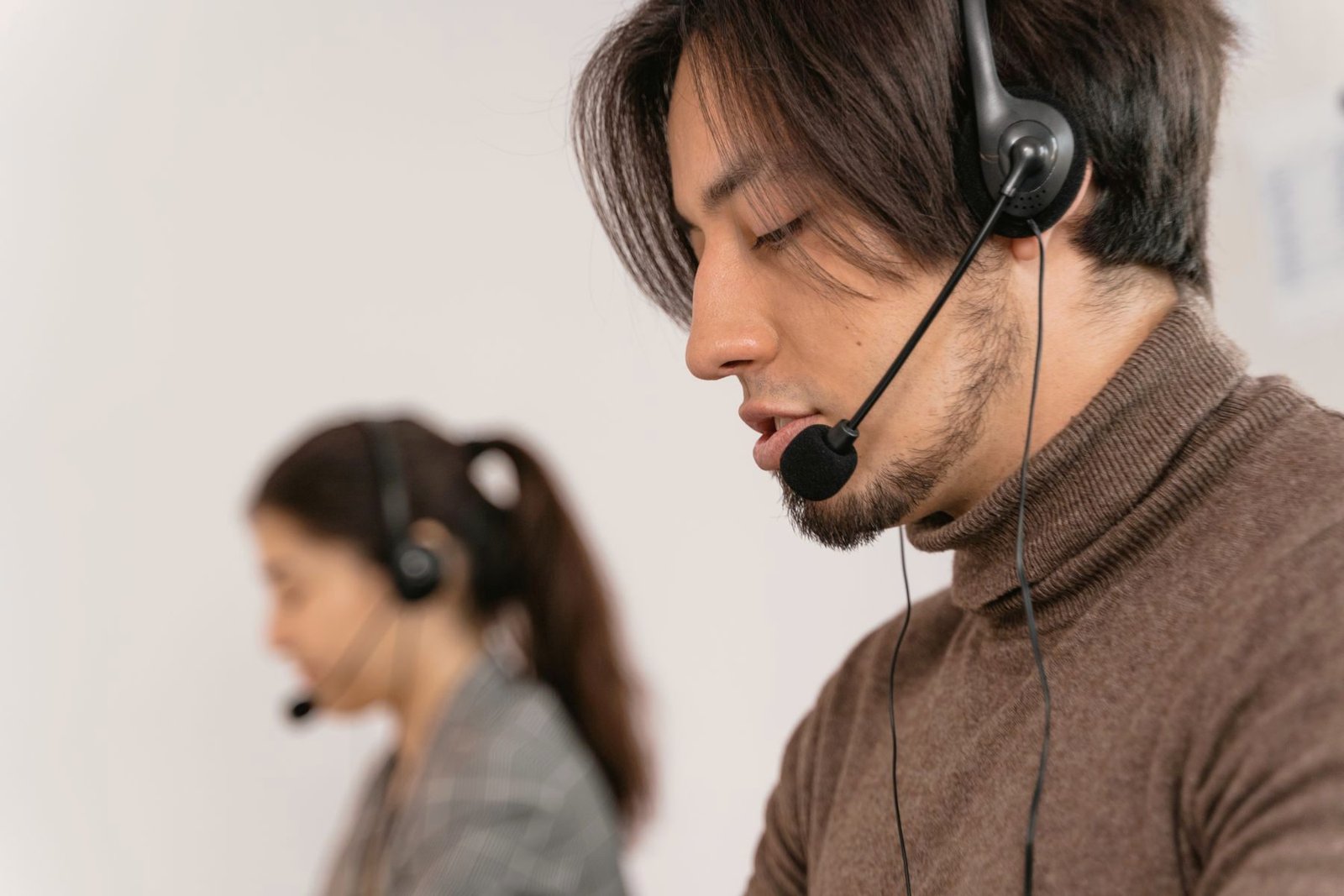 An operator wearing a headset helping a caller